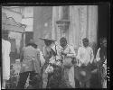 Group of people in traditional clothing in street