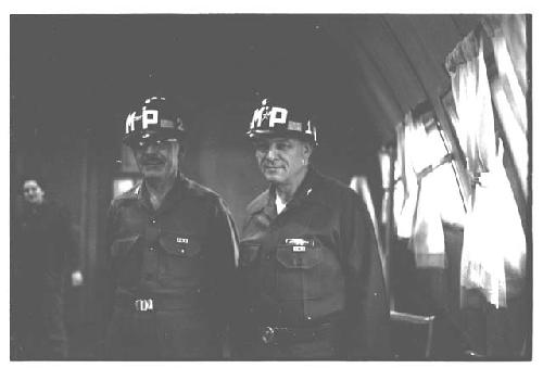 General Whitcomb and another American officer posing in military police helmets
