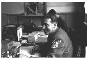 German Red Cross worker sitting at desk