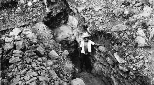 Boy standing in trench