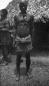 Man wearing cast brass snuff horn, half Grebo Kunebo clan