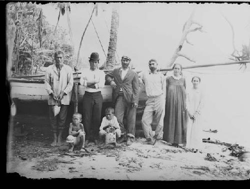 People in front of boat