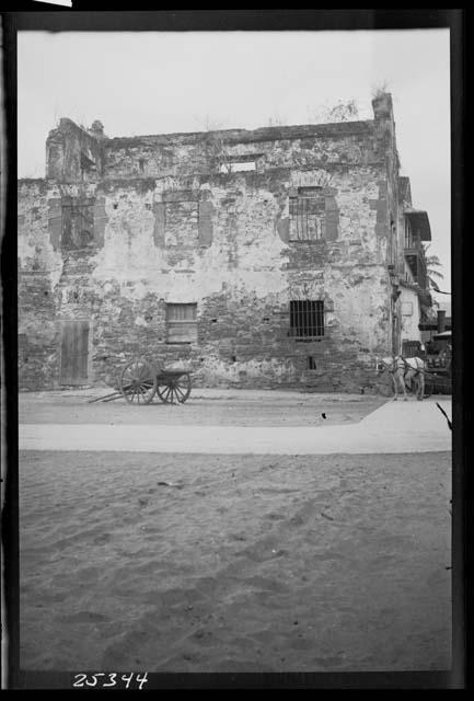 Cannon in front of house