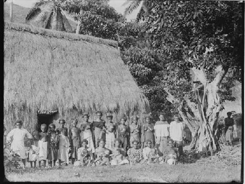 Native People in front of Hut