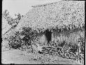 Two Women in front of Hut