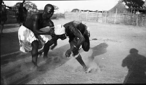 Two men wrestling