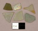 Glass, flat, clear, green, and white colored, various sizes and shapes
