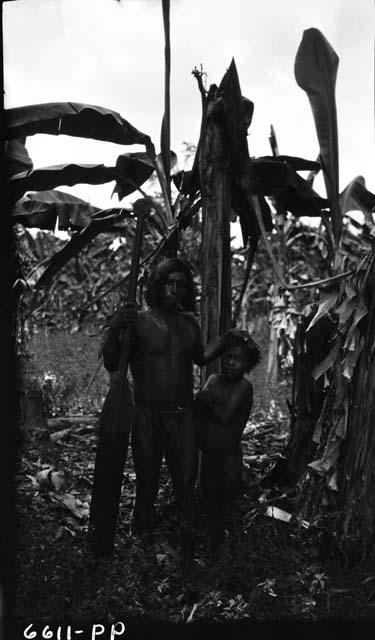 Man and boy in jungle