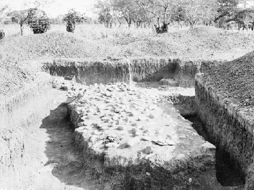 Excavation 3-31. View of trench showing stone mound