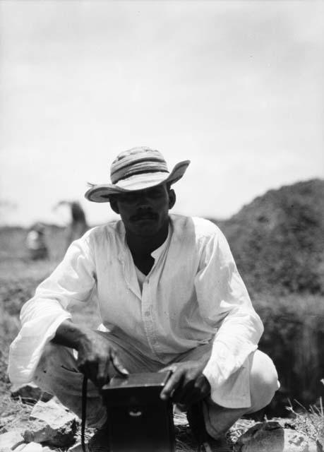 Baltazar Ramos at dig site 2 with box