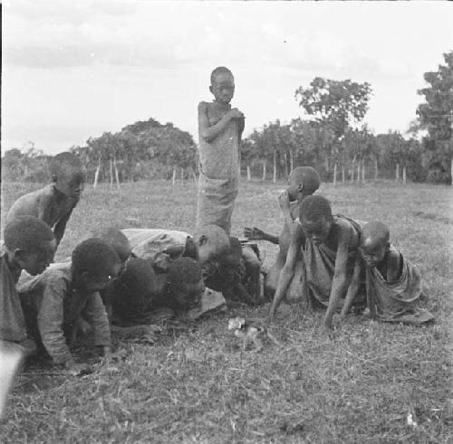 Native children watching a monkey