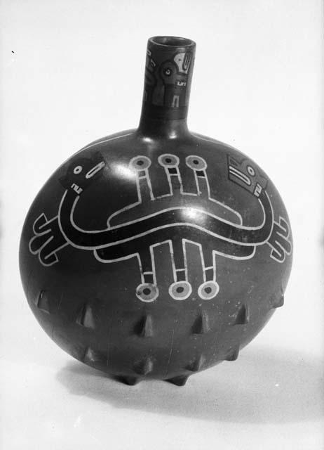 Flask of brown ware with lugs and conventionalized animal motif