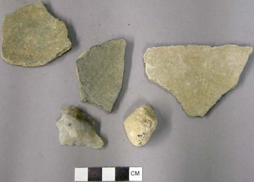 Ceramic unslipped plainware potsherds, stone chips and limestone