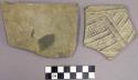 One plain and one black on white sherd with geometric pattern