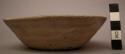 Bowl, ceramic, flat base, slightly flared sides, chipped rim, fire clouded