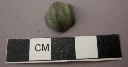 Ceramic spindle whorl fragment