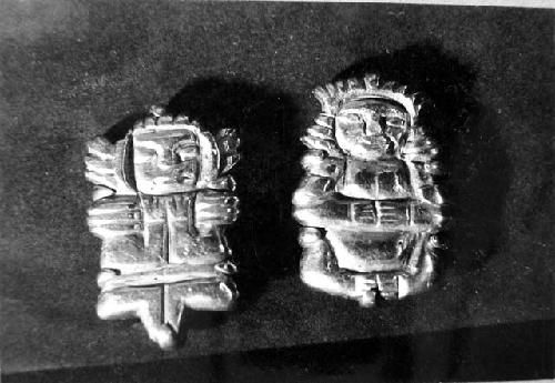 Gold objects said to have been found in a small red pot