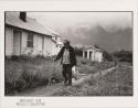 Excrusion Inlet: older Native American woman walking along path