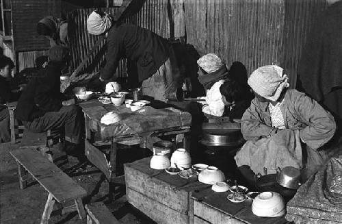 People at a street restaurant