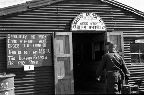 Military men entering barracks