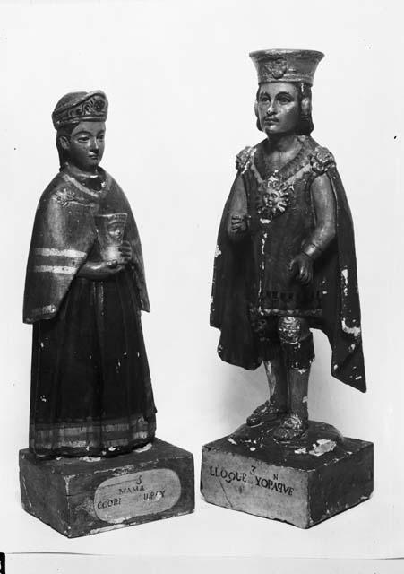 Male and female carved wooden figurines