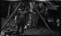 Man standing in front of wooden structure