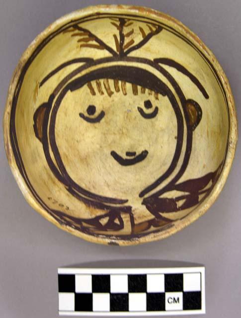 Bowl, polacca polychrome style c. int: clown design; ext: slipped, no design. 6.