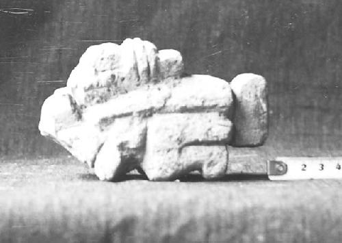 Str. Q-156. Small sculpture in debris on altar cat #54-43. left side