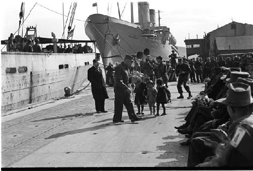 Crowd in front of ship front view