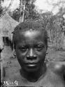 Frontal view of young Karu woman with facial tattooing