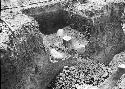 Stone columns and altar stones in trench, trench 10 excavation