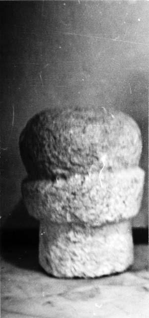 Limestone cylindrical shaft, ringed, topped by a sphere