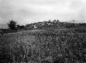 Church ruins and modern graves on top. Tumba site, facing west