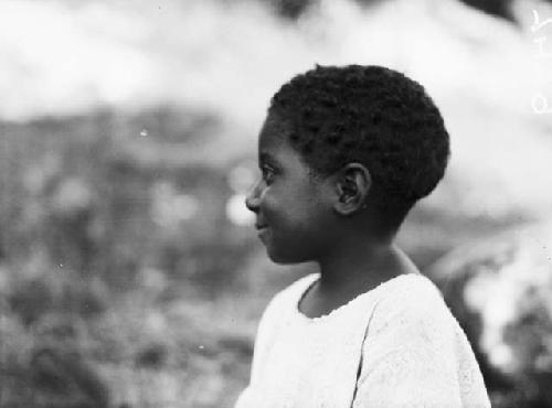 Profile view of young, mixed race African child