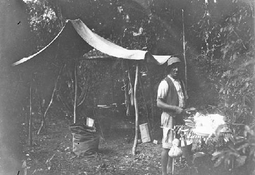 Henry Ewing preparing meal in overnight camp