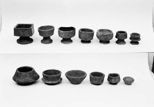 Seven pottery cups on flaring bases, six pottery bowls