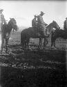 Four Kazak men on horses