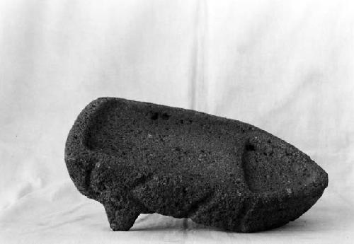 Metate carved as a "sapo" with two feet