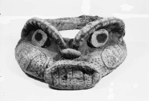 Head-piece in form of animal head covered with painted bark cloth