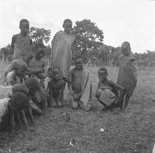 Native children watching a monkey