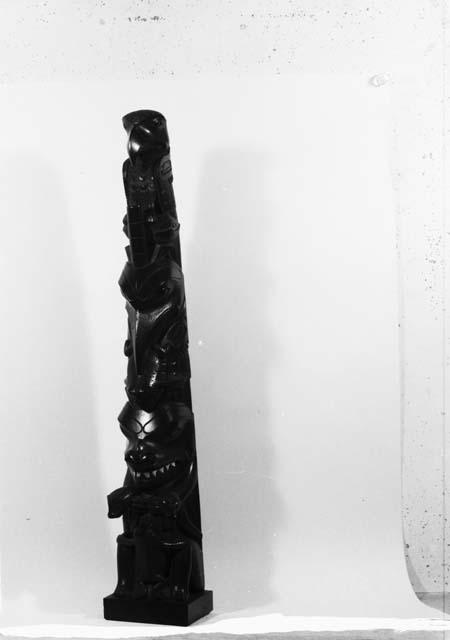 Miniature totem pole carved from black slate