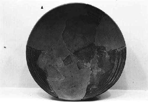 Abajo red on orange pottery bowl from Pueblo I level, site 13