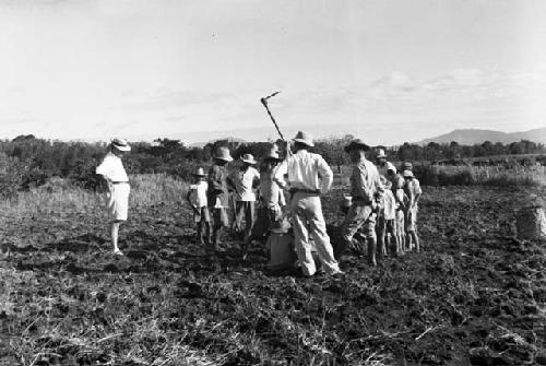 Men digging at site, excavation