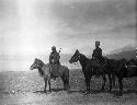 Owen Lattimore and escort on horseback