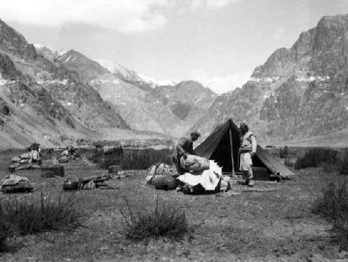Two men at camp near Kichig Karakorum