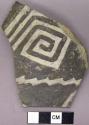 Sherd with black on white exterior geometric designs