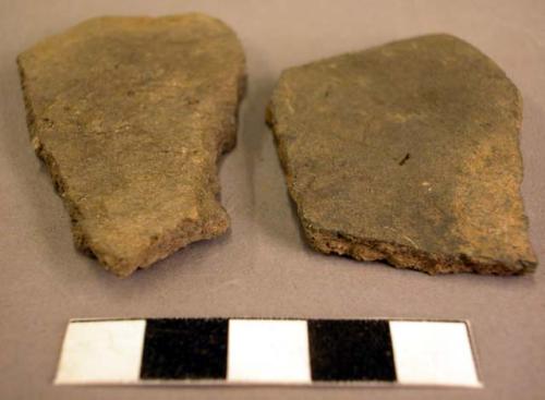 Ceramic rim and body sherds, undecorated, corrugated, burnt