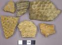 Corrugated potsherds, one possible limestone