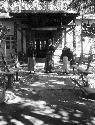 Three men standing in an entryway