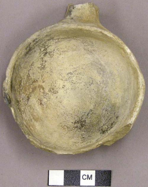 Fragment of plain small pottery ladle